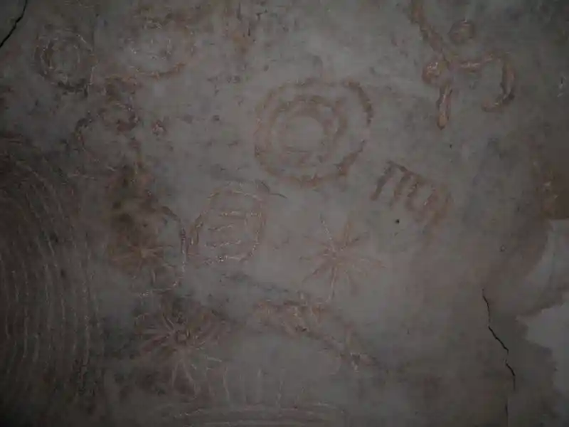 Solar disc and other solar symbols on a stone in the grave of Jeremiah